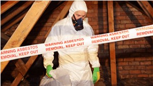 Asbestos removal service in Tabernash CO with technician in protective gear handling hazardous materials