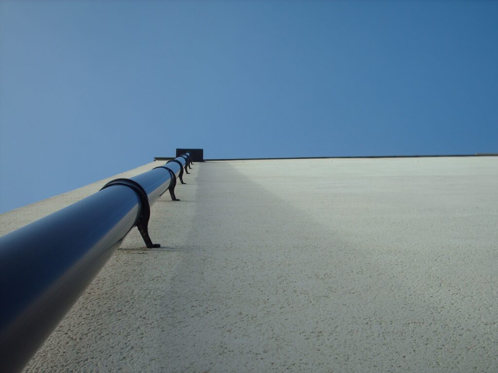 Rain gutter running along the edge of a roof