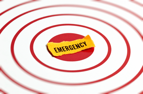 Emergency label at the center of a red target